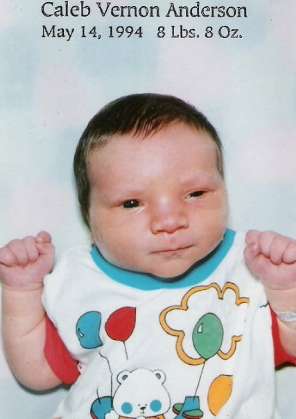 A hand holding a baby
Description automatically generated